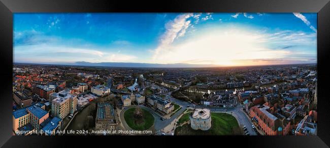 Panoramic aerial view of a city at sunset with dramatic sky and urban landscape in York, North Yorkshire Framed Print by Man And Life