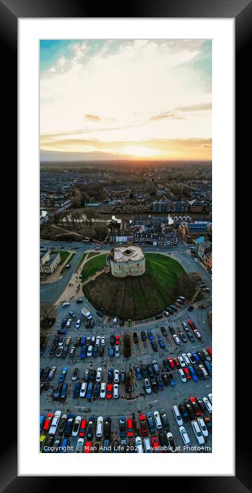 Aerial view of a parking lot and building at sunset with dramatic sky in York, North Yorkshire Framed Mounted Print by Man And Life