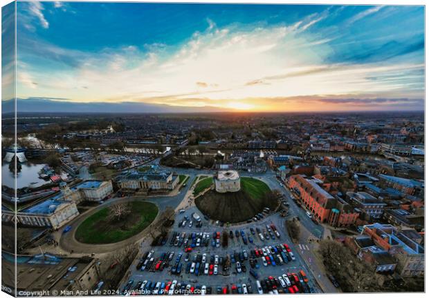 Aerial view of a cityscape at sunset with vibrant skies and parking lot in the foreground in York, North Yorkshire Canvas Print by Man And Life