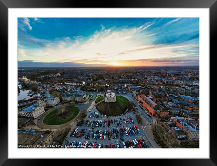Aerial view of a cityscape at sunset with vibrant skies and parking lot in the foreground in York, North Yorkshire Framed Mounted Print by Man And Life