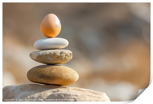 A photograph showcasing a stack of rocks with a ca Print by Joaquin Corbalan