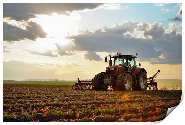 A large tractor working on a field with big machines. Print by Michael Piepgras
