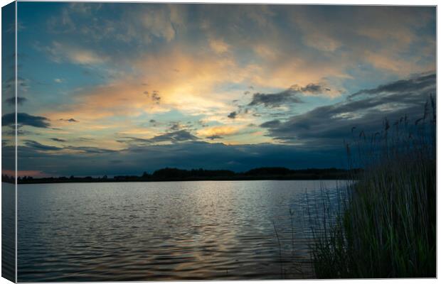 Clouds after sunset over the lake with reeds Canvas Print by Dariusz Banaszuk
