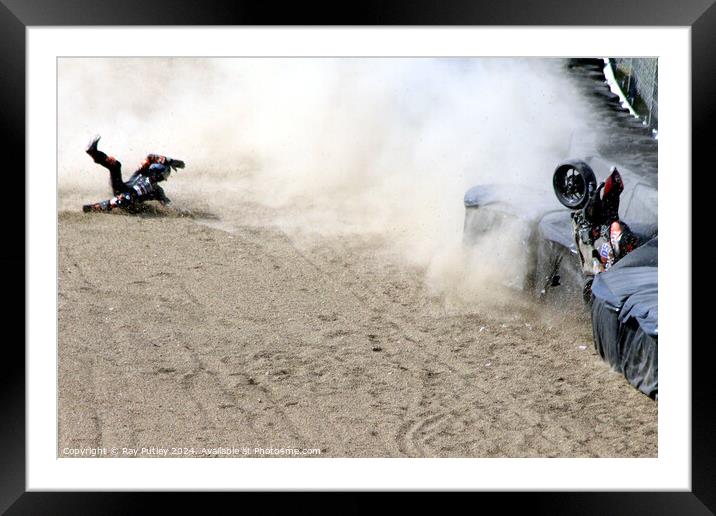 A man riding a motorcycle down a dirt road Framed Mounted Print by Ray Putley