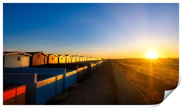 Sunset over the Walings beach huts Frinton-on-Sea Print by Paula Tracy