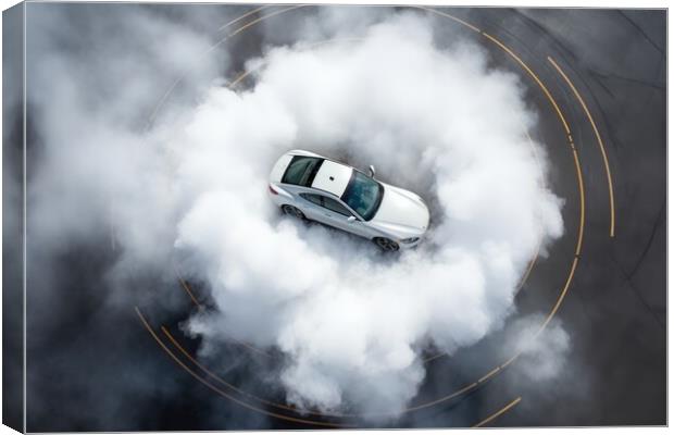 Aerial view of a sports car making donuts. Canvas Print by Michael Piepgras