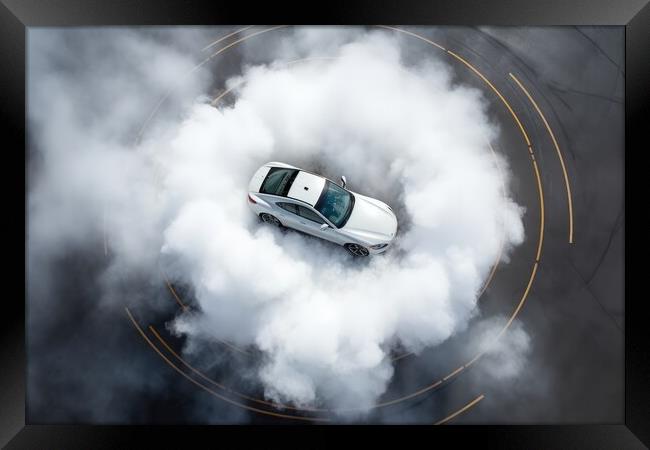 Aerial view of a sports car making donuts. Framed Print by Michael Piepgras