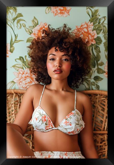 A black woman wearing a bikini top sits on a wicker chair. Framed Print by Joaquin Corbalan