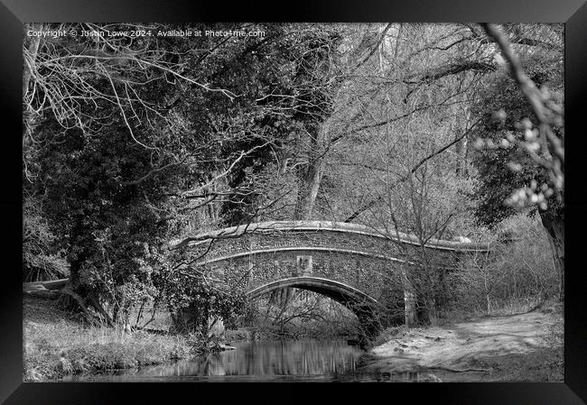 Bridge through the trees Framed Print by Justin Lowe