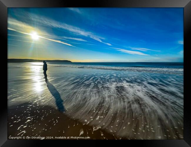 A Solo Walker on Woolacombe Beach. Framed Print by Ian Donaldson