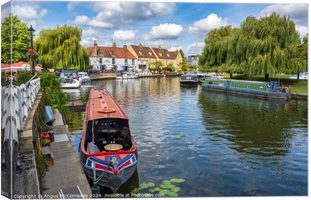 Barges moored on the River Great Ouse at Ely Canvas Print by Angus McComiskey