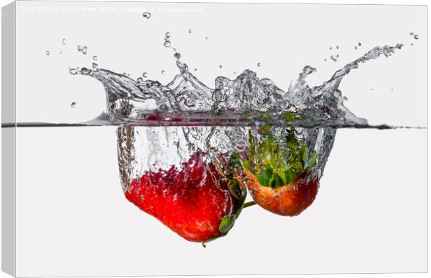 Splash Strawberries Canvas Print by John Parker