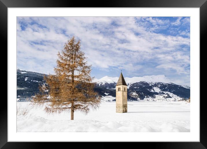 Resia Lake with the sunken church tower in winter Framed Mounted Print by Melanie Viola