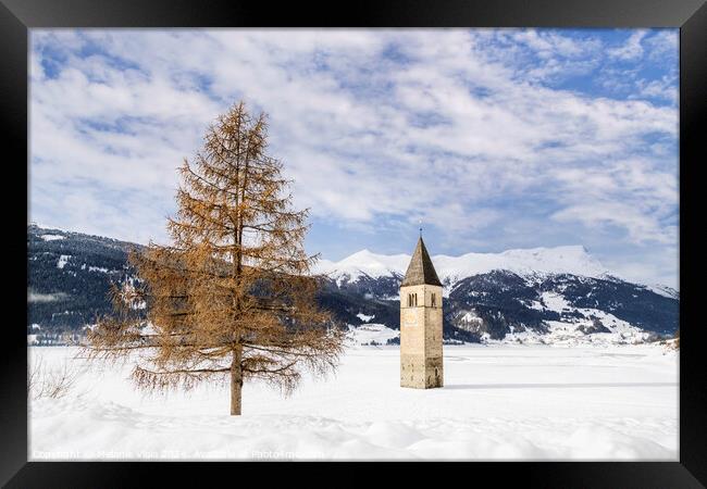 Resia Lake with the sunken church tower in winter Framed Print by Melanie Viola