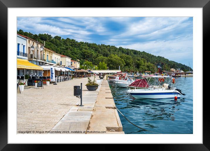 Boats moored on quayside of Katakolon, Greece Framed Mounted Print by Angus McComiskey
