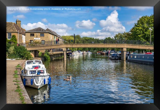 Boats moored on the River Great Ouse at Ely Framed Print by Angus McComiskey