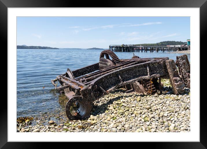 Abandoned Machinery  on the beach of Alert Bay with an old disused pier behind behind, British Columbia, Canada Framed Mounted Print by Dave Collins