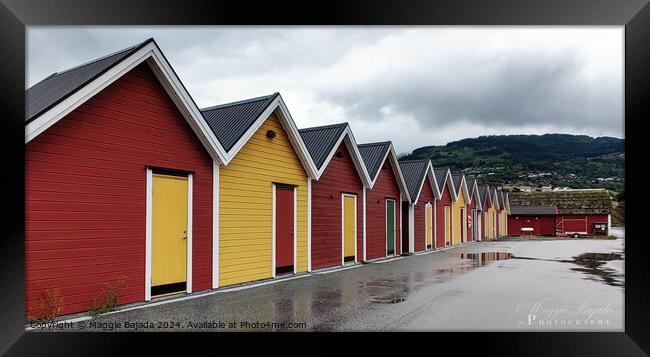 Boat houses in Red and Yellow with Mountains background in Norway Framed Print by Maggie Bajada