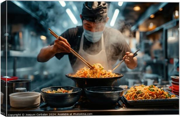 A man is seen in a kitchen using chopsticks to prepare food, possibly Japanese ramen. He is focused on the task at hand. Canvas Print by Joaquin Corbalan