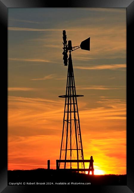 Kansas Golden Sky with clouds with a Farm Windmill silhouette Framed Print by Robert Brozek