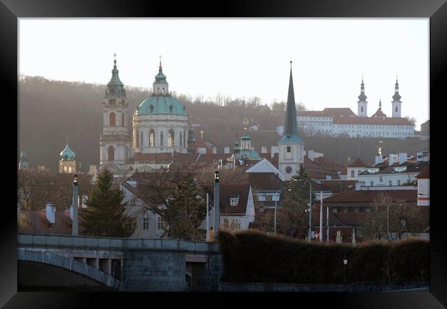 Church towers and historic buildings in the evening sun in Prague Framed Print by Lensw0rld 