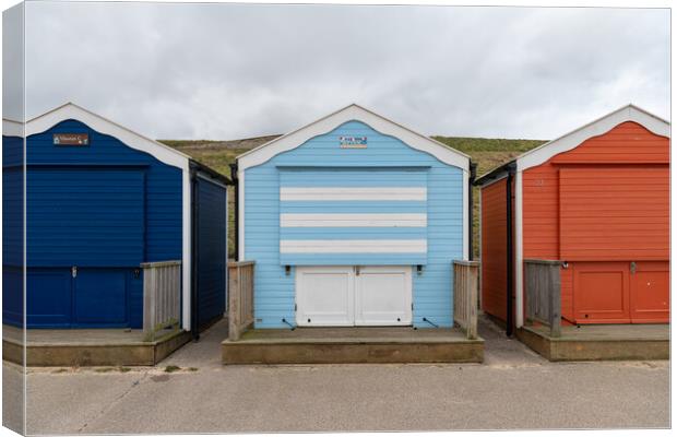 Colourful beach huts shut for winter, Gorleston, Norfolk, England Canvas Print by Dave Collins