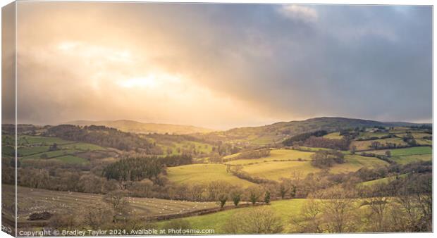 Welsh Countryside - Sun Breaking Through Clouds Canvas Print by Bradley Taylor
