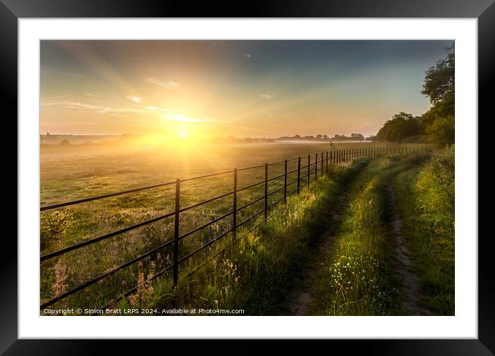 Super sunrise over farm fields cattle fence and track Framed Mounted Print by Simon Bratt LRPS