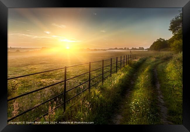 Super sunrise over farm fields cattle fence and track Framed Print by Simon Bratt LRPS