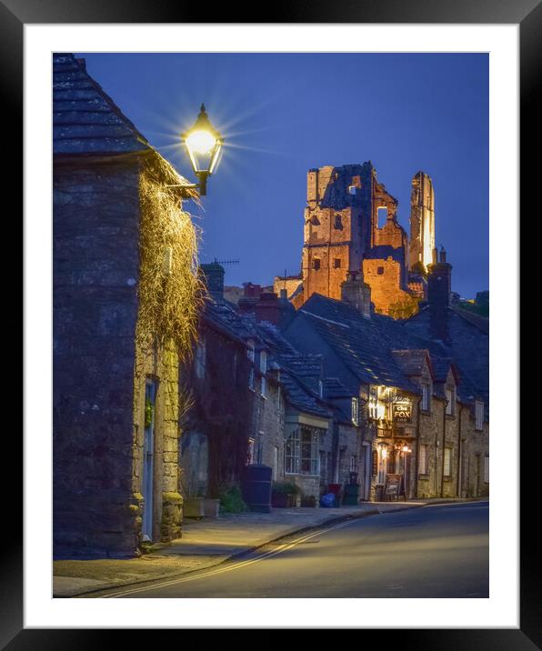 Corfe Castle Illuminated  Framed Mounted Print by Shaun Jacobs