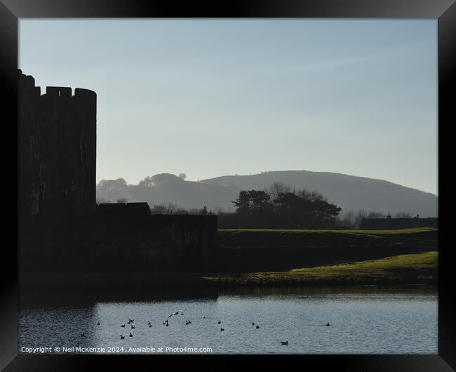 Caerphilly Castle at sunrise  Framed Print by Neil McKenzie