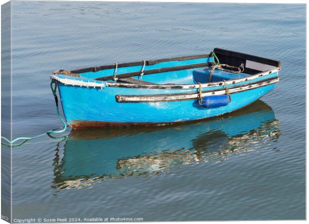 Bright Blue Skiff at the Harbour Canvas Print by Susie Peek