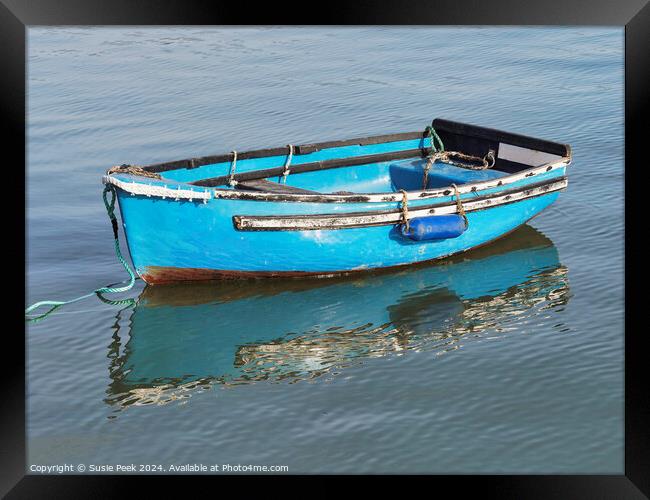 Bright Blue Skiff at the Harbour Framed Print by Susie Peek