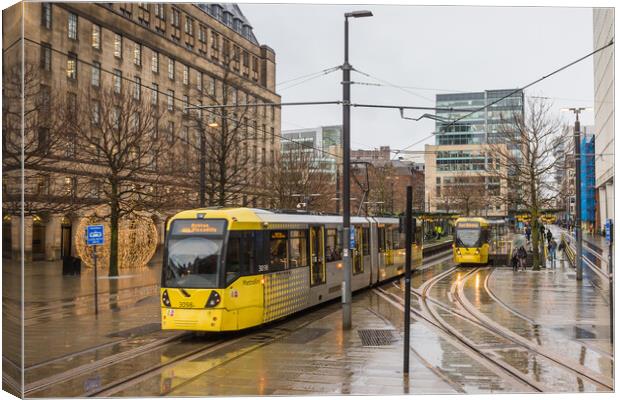 Trams passing in Manchester city centre Canvas Print by Jason Wells