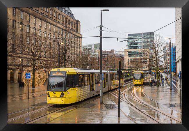 Trams passing in Manchester city centre Framed Print by Jason Wells