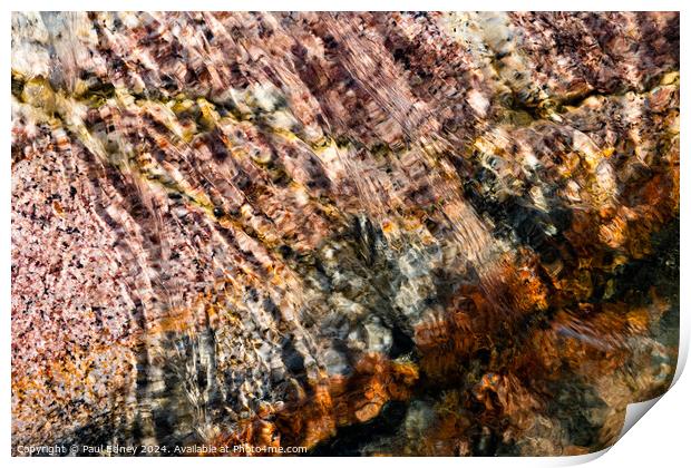 Abstract water over coloured rocks Print by Paul Edney