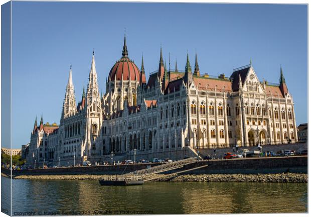 Colorful buildings of Hungarian Parliament in Budapest.  Canvas Print by Maggie Bajada