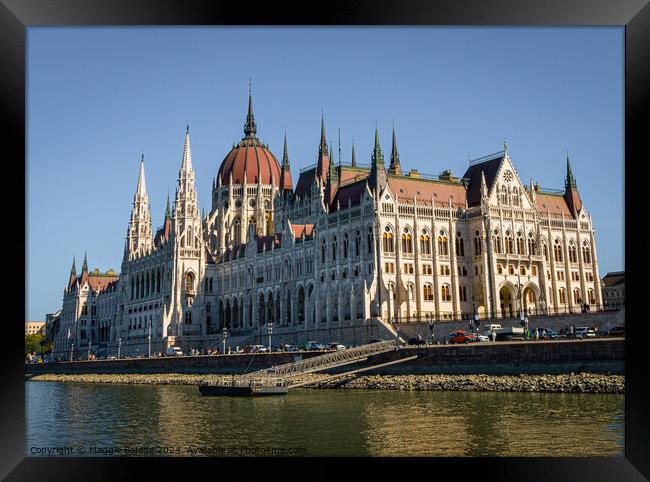 Colorful buildings of Hungarian Parliament in Budapest.  Framed Print by Maggie Bajada