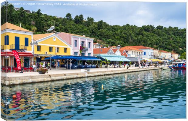 Colourful waterfront buildings at Katakolon Greece Canvas Print by Angus McComiskey