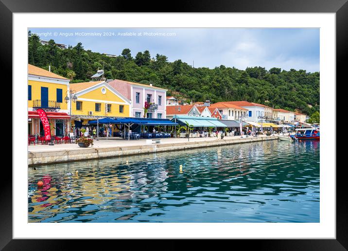 Colourful waterfront buildings at Katakolon Greece Framed Mounted Print by Angus McComiskey