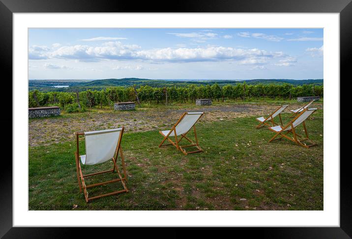 White Wooden Deck Chairs with Italian Scenery Land Framed Mounted Print by Maggie Bajada