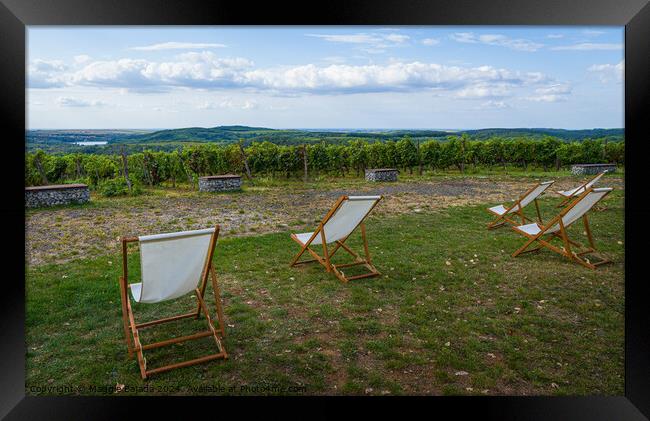 White Wooden Deck Chairs with Italian Scenery Land Framed Print by Maggie Bajada