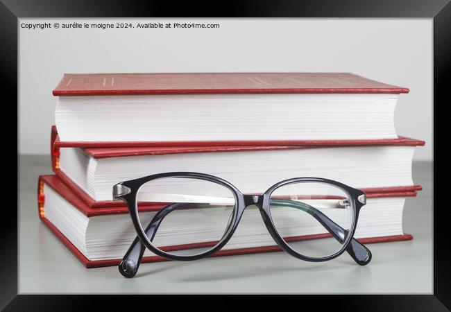 Heap of red books and glasses Framed Print by aurélie le moigne
