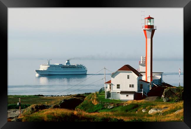 Ship passing Lighthouse Framed Print by Dave Reede
