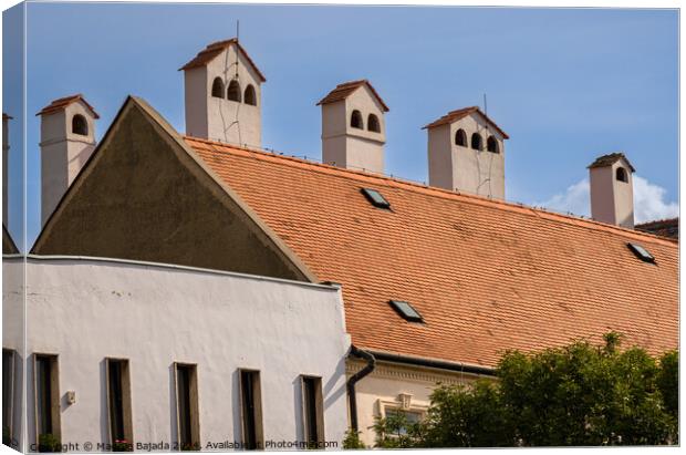 Architecture of an Hungarian chimney with Red tiled roof.  Canvas Print by Maggie Bajada