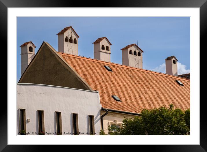 Architecture of an Hungarian chimney with Red tiled roof.  Framed Mounted Print by Maggie Bajada