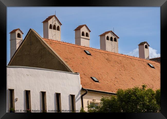 Architecture of an Hungarian chimney with Red tiled roof.  Framed Print by Maggie Bajada