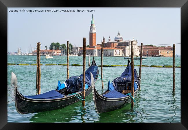 Gondolas on waterfront promenade in Venice Framed Print by Angus McComiskey
