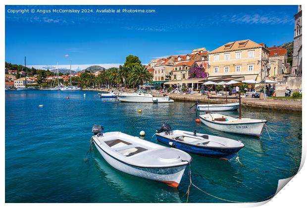 Boats tied up on waterfront of Cavtat in Croatia Print by Angus McComiskey