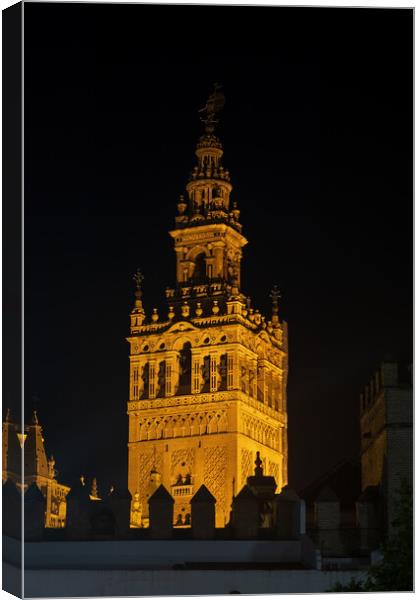 Giralda Bell Tower Of Seville Cathedral At Night Canvas Print by Artur Bogacki
